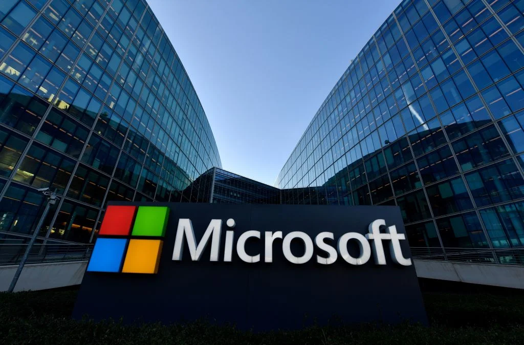Microsoft sign outside a modern office building